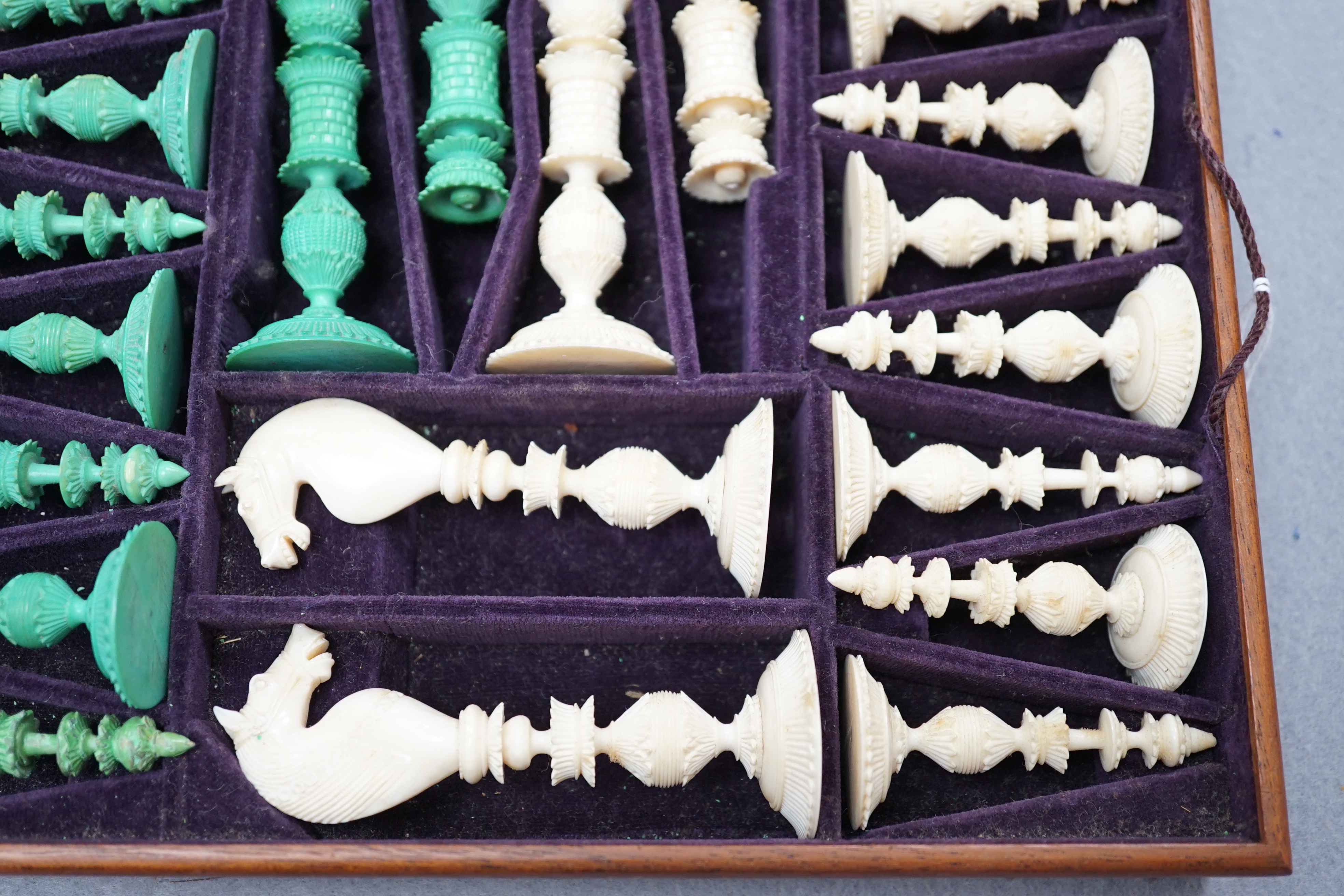 A boxed 19th century Burmese pattern ivory chess set, one pawn restored, king height 11cm